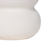 Detail of the white vase's textured lower curve and smoother band between rounded sections.