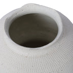 Close view into the vase opening, showing the undulating white rim and textured shoulder.