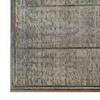 Overhead detail of the console tabletop, showing rectangular panels, a narrow border and dense dark markings across the pale distressed surface.