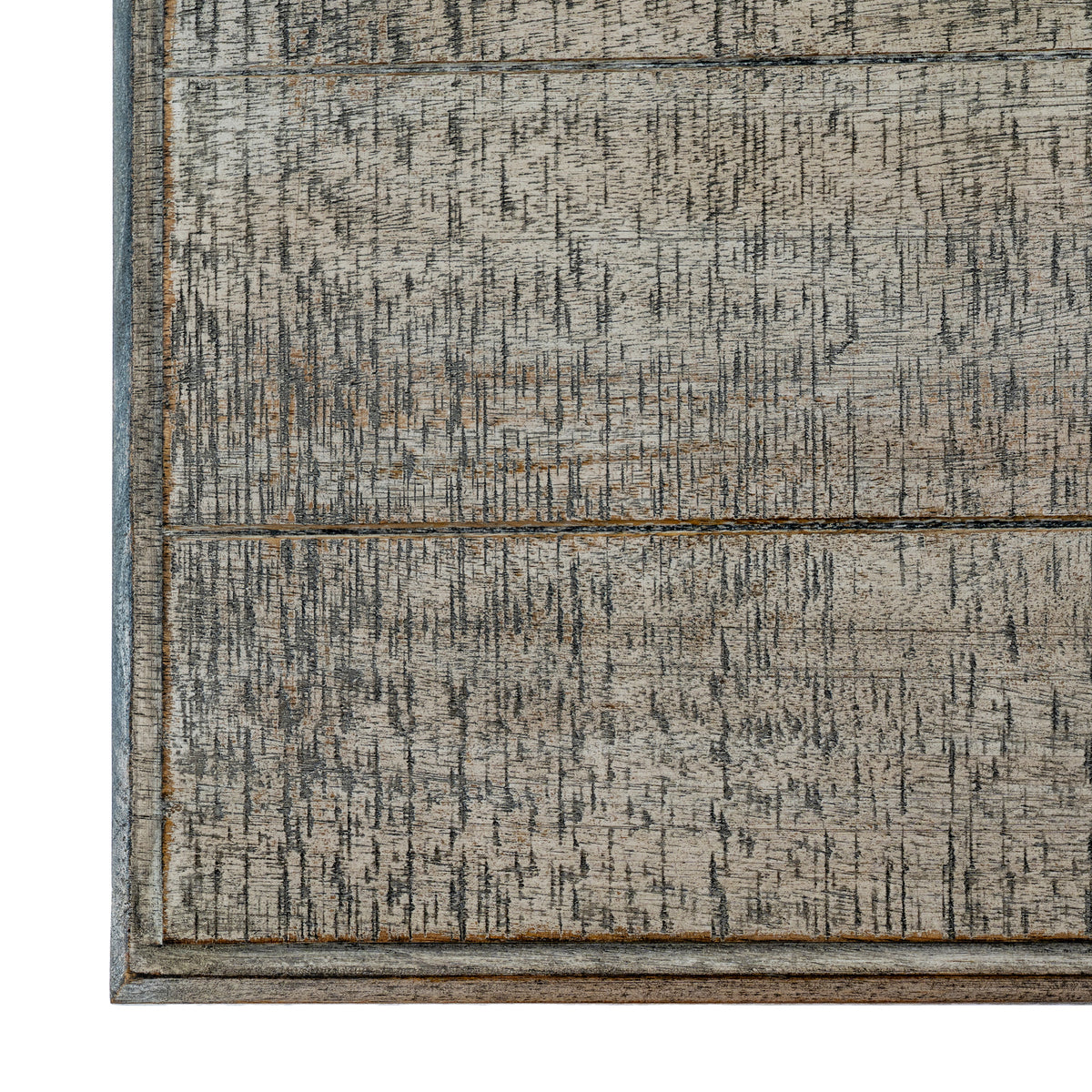 Overhead detail of the console tabletop, showing rectangular panels, a narrow border and dense dark markings across the pale distressed surface.