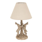 Twin Haretreestem Table Lamp with a cream tapered shade above two upright hares flanking a textured tree-like stem.