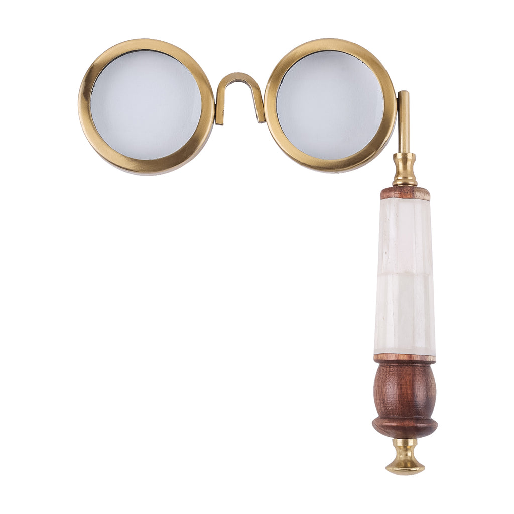 Front view of the magnifier with two round gold-toned lens frames and a vertical white and brown handle on a white background.