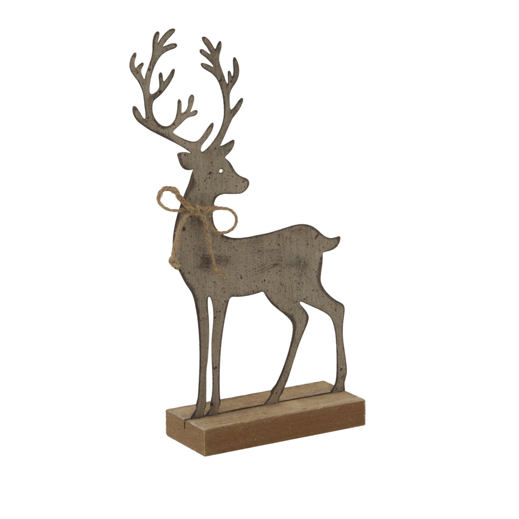 Angled view of the standing reindeer decoration showing its slim silhouette, speckled finish, twine bow and the depth of its block base.