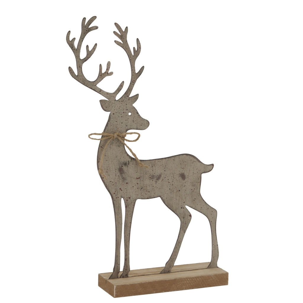 Angled view of the standing reindeer decoration showing its mottled grey-brown finish, twine bow and the top and front of its neutral-toned base.