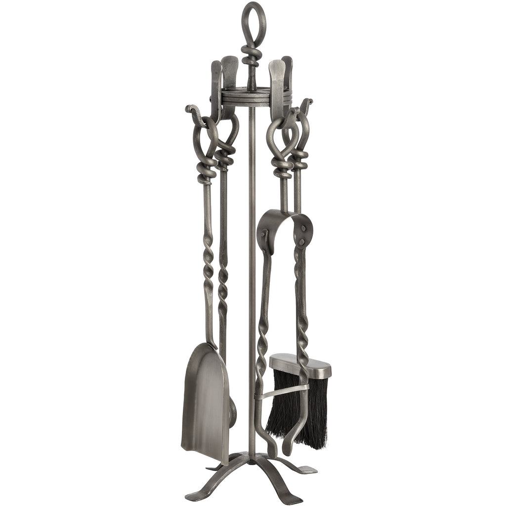 Alternate view of the fireplace tool stand showing the shovel on the left, tong-like implement on the right and twisted sections along the shafts.