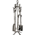 Alternate view of the fireplace tool stand showing the shovel on the left, tong-like implement on the right and twisted sections along the shafts.