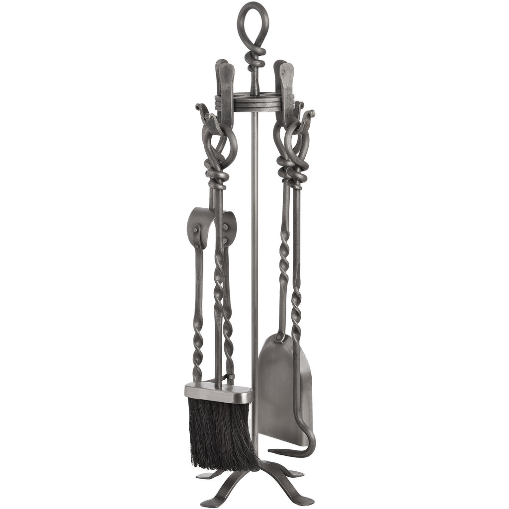 Grey fireplace tool set on four curved feet, with a black-bristled brush at the front and looped handles beneath a knot-shaped top.