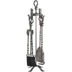 Grey fireplace tool set on four curved feet, with a black-bristled brush at the front and looped handles beneath a knot-shaped top.
