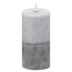 Grey cylindrical LED candle on a white background, showing pale mottling above a darker grey lower section and a white flame-shaped element.