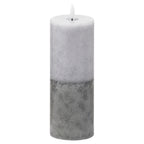 Tall cylindrical LED candle with pale grey-white mottling above a darker grey base and a white flame-shaped element, against a white background.