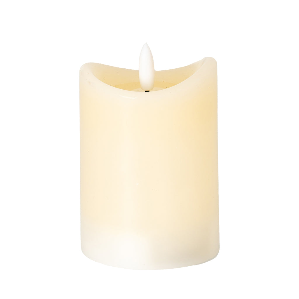 Cream cylindrical LED candle on a white background, showing an uneven concave rim, recessed top and white flame-shaped centre.