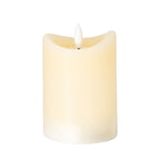 Cream cylindrical LED candle on a white background, showing an uneven concave rim, recessed top and white flame-shaped centre.