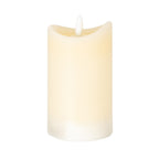 Cream cylindrical LED candle on a white background, showing its uneven concave rim, recessed top and central white flame-shaped element.