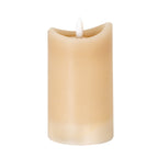Taupe cylindrical LED candle on a white background, showing its uneven concave rim, recessed top and white flame-shaped detail.