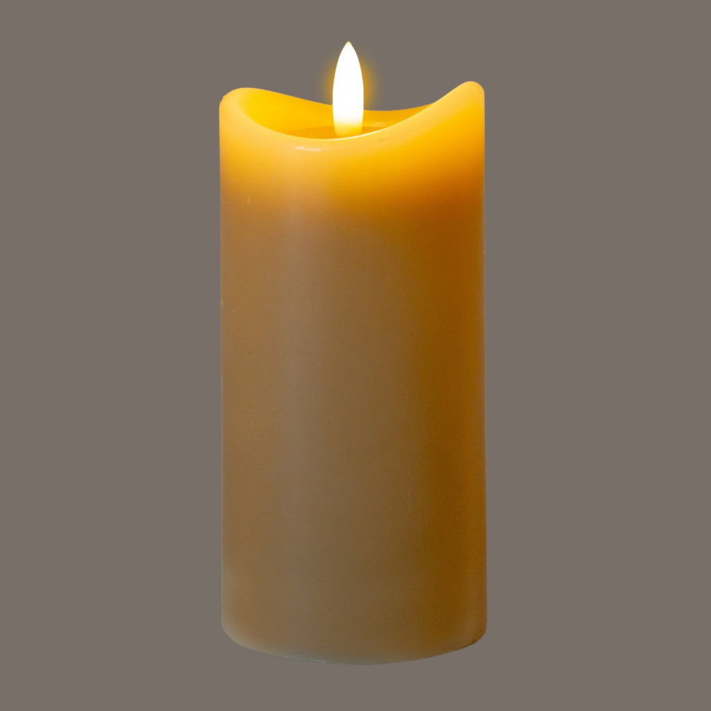 Taupe LED candle photographed against a grey background, with the flame-shaped detail appearing bright white and a golden glow around the curved top.