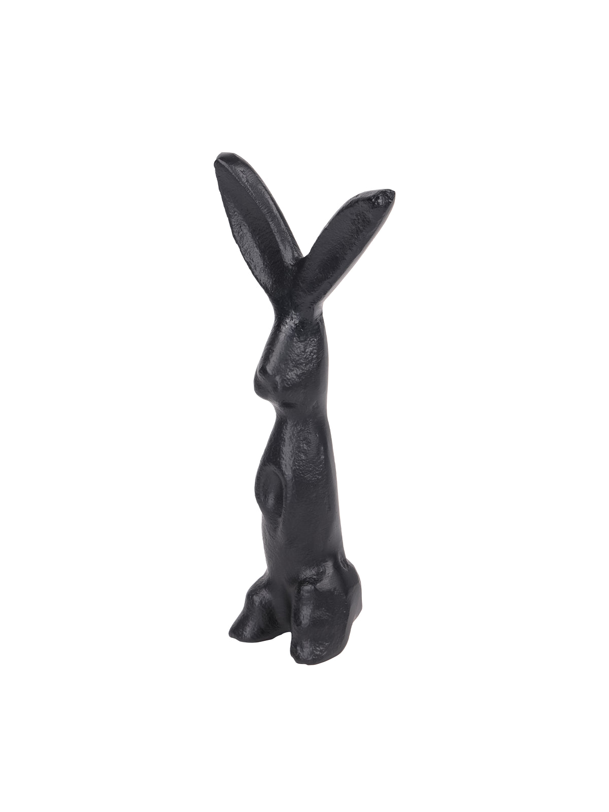 Angled view of the black hare sculpture showing its projecting muzzle, forepaws and textured surface.