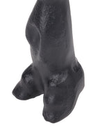 Close-up of the hare sculpture's lower body and hind feet, with light catching the textured black surface.