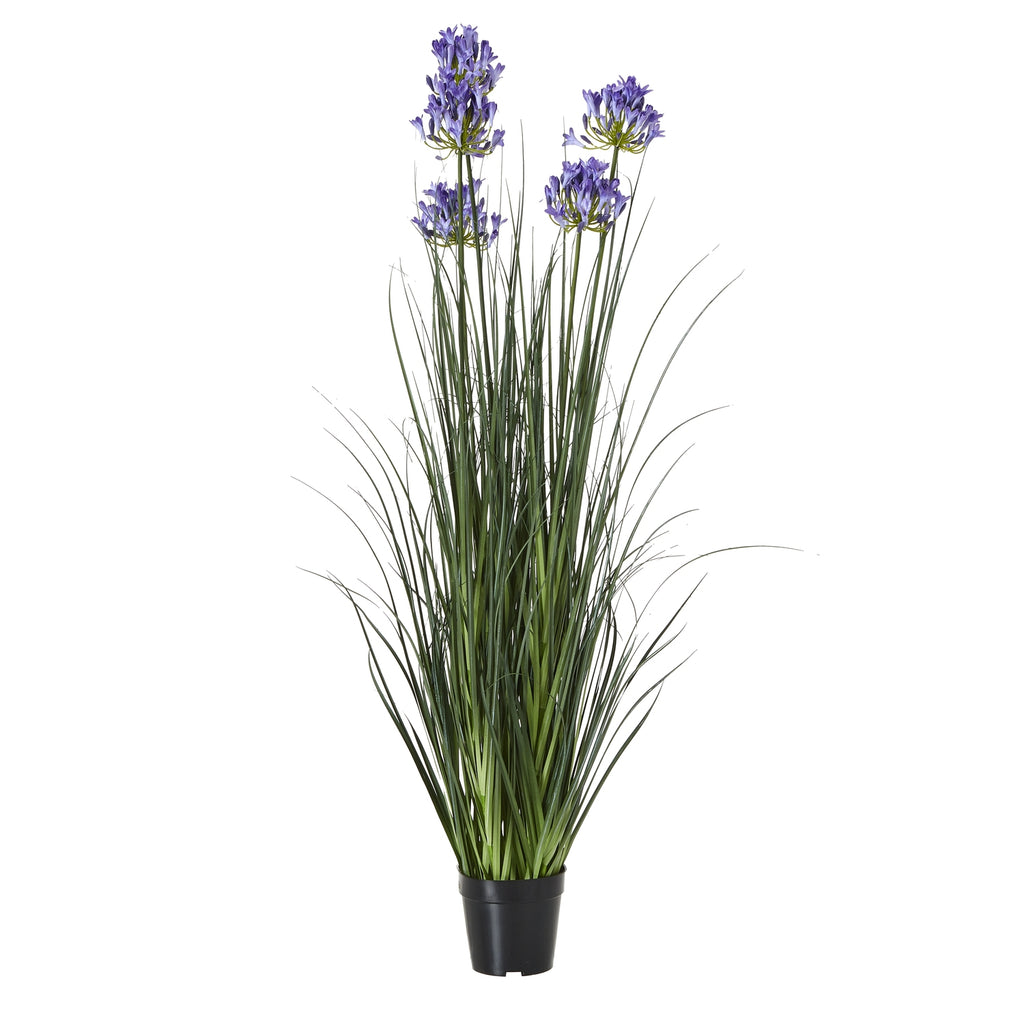 Full view of a tall artificial arrangement with narrow green foliage and blue-violet flower clusters in a tapered black pot.