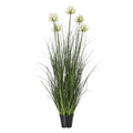 Full view of the artificial arrangement with cream-white flower clusters at varied heights above tall green foliage and a tapered black pot.