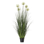 Full view of the artificial arrangement with cream-white flower clusters at varied heights above tall green foliage and a tapered black pot.