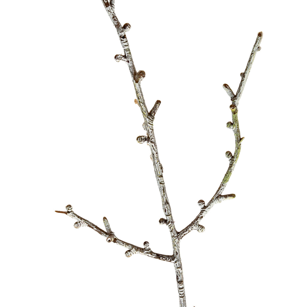 Close-up of intersecting artificial twigs, showing short branch stubs and an irregular pale mottled finish over brown tones.