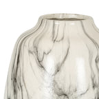 Close-up of fine grey lines and branching black veins across the glossy white surface below the vase rim.