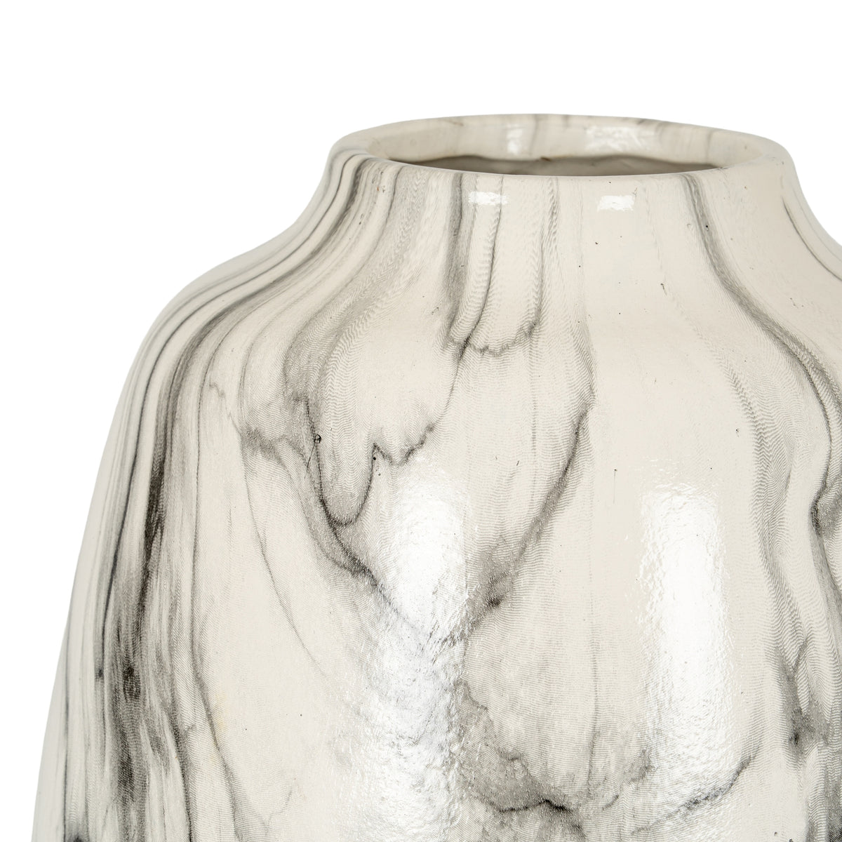 Close-up of fine grey lines and branching black veins across the glossy white surface below the vase rim.