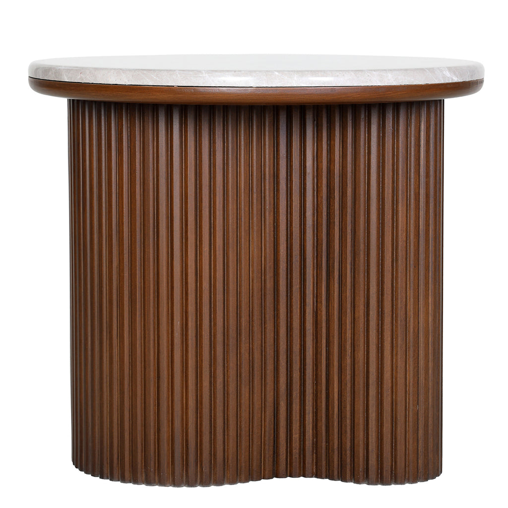Front view of a round side table with a pale marble top and a brown fluted pedestal curving inwards at the centre.