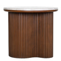 Front view of a round side table with a pale marble top and a brown fluted pedestal curving inwards at the centre.