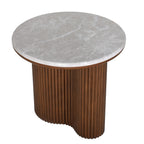 Angled view from above showing the side table's round grey marble top, white veining and curved brown fluted base.