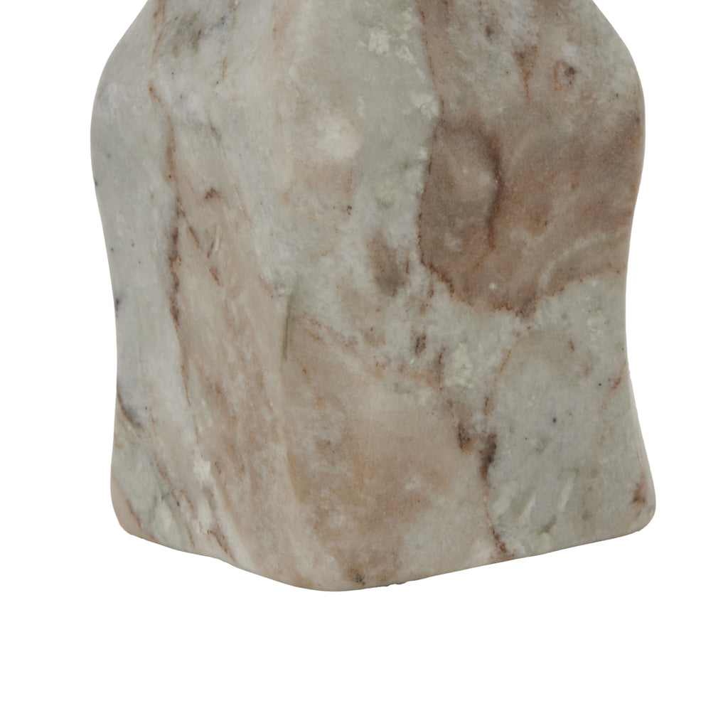 Close-up of the doorstop body showing broad tan patches, fine grey veining and a softly rounded lower corner.