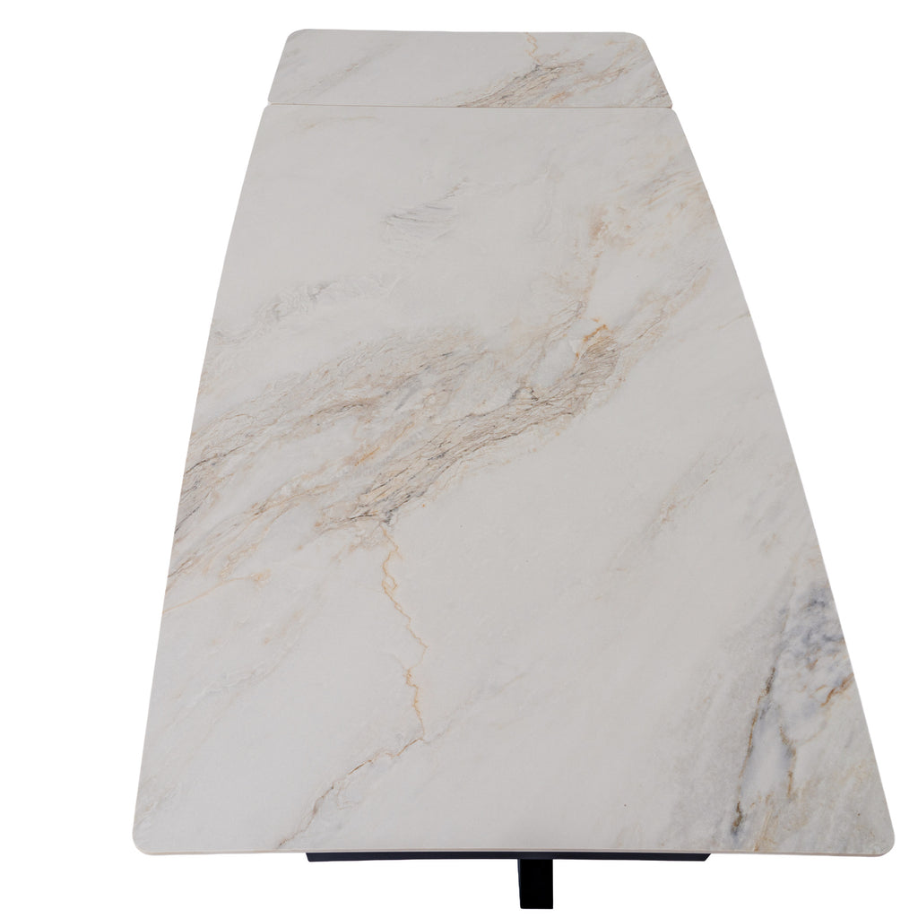 View along the pale rectangular tabletop showing grey and warm-toned veining and a seam across an end panel.