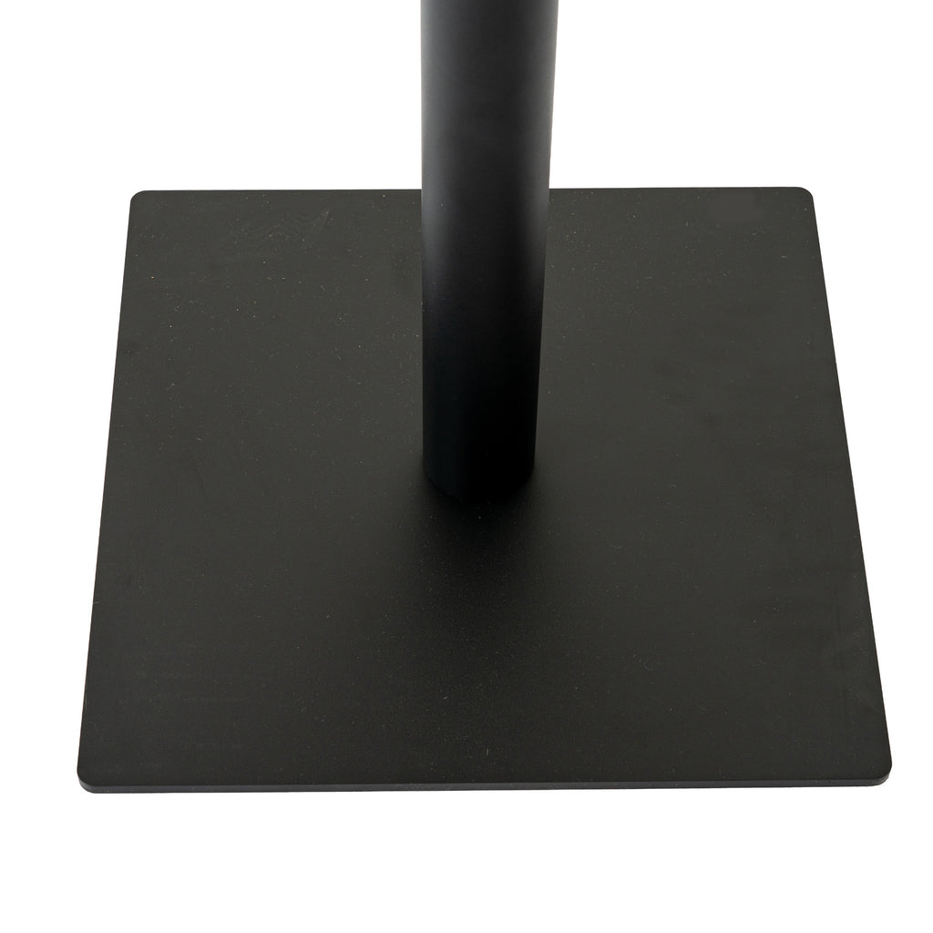 Close-up of the dark cylindrical pedestal meeting the low square base, showing its thin edge and gently rounded corners.