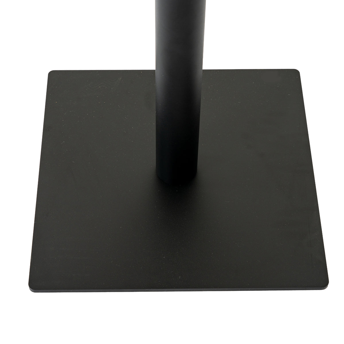 Close-up of the dark cylindrical pedestal meeting the low square base, showing its thin edge and gently rounded corners.