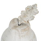 Close-up of the pear ornament's indented top and lobed leaf, showing raised branching veins and orange-brown markings.