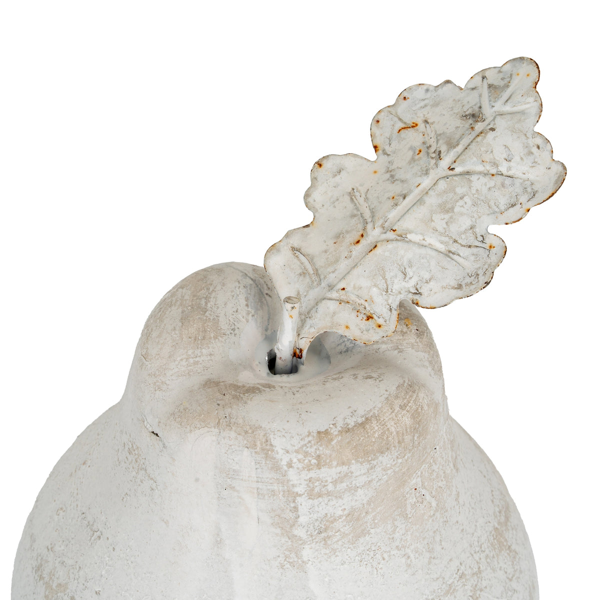 Close-up of the pear ornament's indented top and lobed leaf, showing raised branching veins and orange-brown markings.