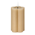 Stone-beige pillar LED candle on a white background, showing rounded vertical lobes, a shallow circular top recess and a white flame-shaped element.