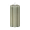Grey-green pillar LED candle on a white background, showing its vertical lobes, recessed top and white flame-shaped detail.