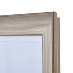Close-up of the frame's upper right mitred corner, showing the beige-white woodgrain-look finish and darker inner edge.
