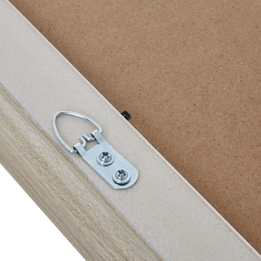 Rear detail of the photo frame with a silver-coloured metal hanging loop secured by two screws beside the tan backing.