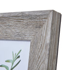 Close-up of the frame's top right mitred corner, showing pale highlights and pronounced grain lines across the wide border.