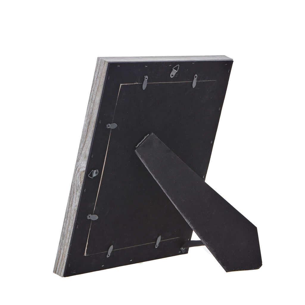 Rear view of the photo frame with its black folding easel extended, retaining tabs around the backing and two hanging loops.