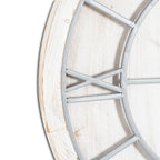 Close-up of the clock's light-grey Roman numeral IX and curved framework against the distressed whitewashed face and rim.