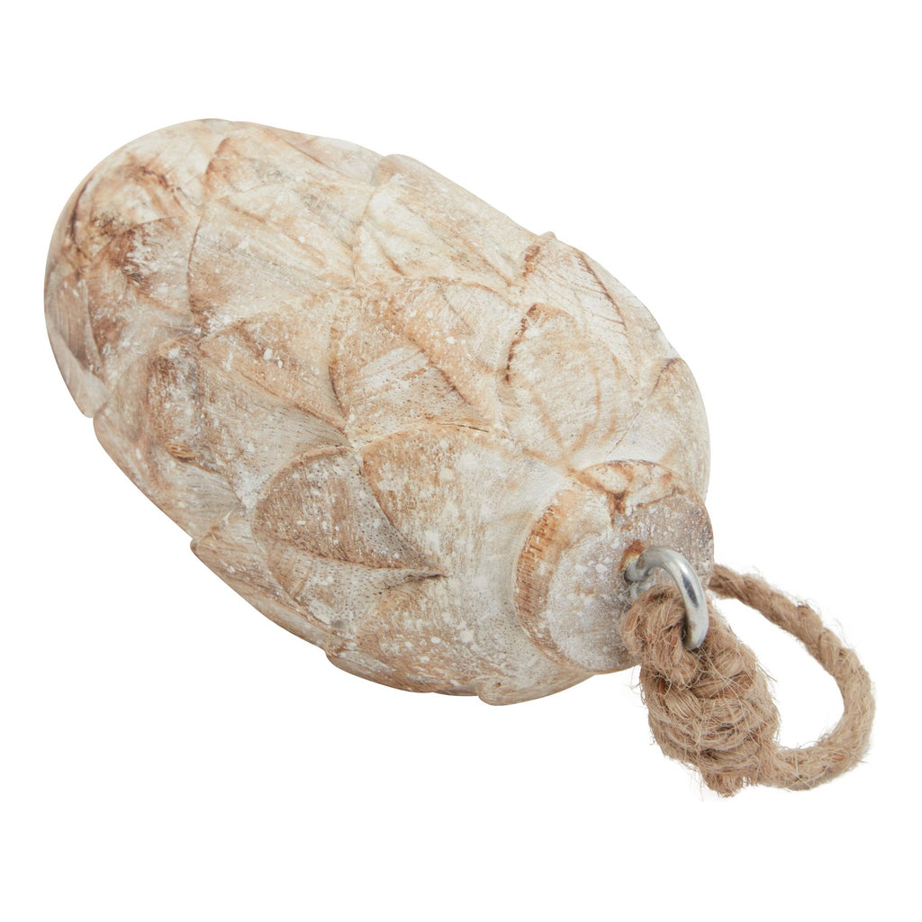 Angled close-up of the ornament showing brown tones beneath the distressed pale wash, raised pinecone scales and the rope knot at the hanging ring.