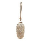 Full view of a pale washed pinecone-shaped ornament with overlapping scales and a long knotted rope hanging loop on a white background.