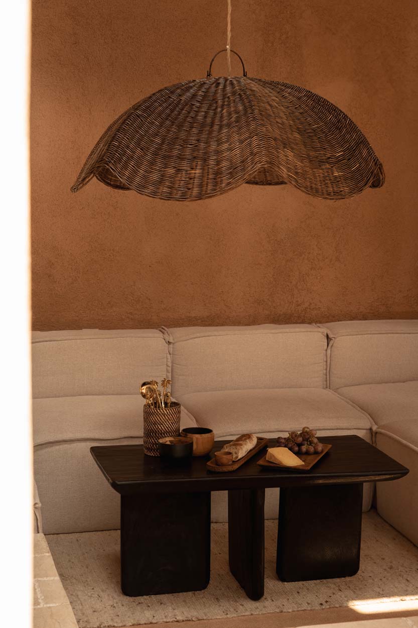Wave Rattan Pendant Light – Dark Walnut, Large — styled in a warm seating area