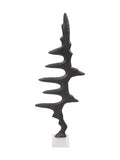 Front view of the dark Waveform Sculpture with irregular pointed peaks and curved gaps on a pale square marble base.