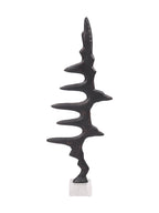 Front view of the dark Waveform Sculpture with irregular pointed peaks and curved gaps on a pale square marble base.