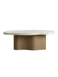 Front view of the Waveline dining table, showing its cream curved top, textured edge and broad brass-toned pedestal.