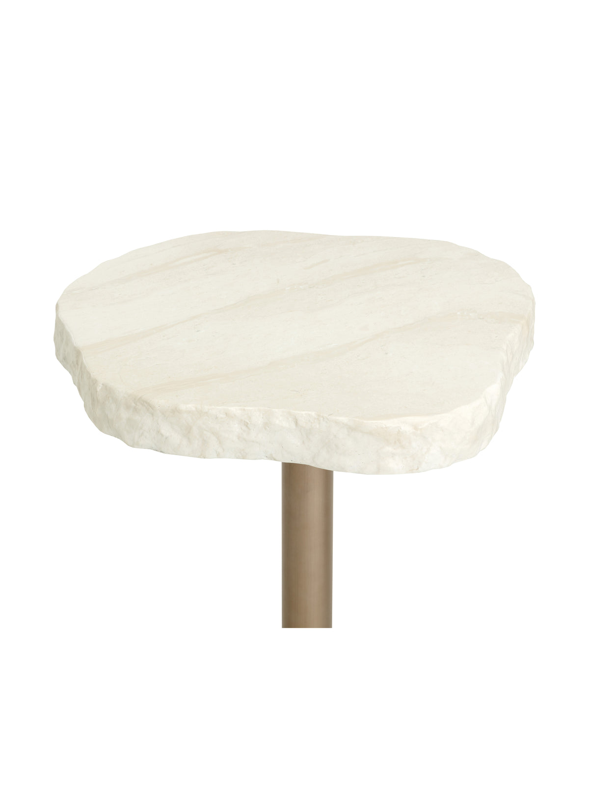 Angled close-up of the cream faux-travertine tabletop showing pale tonal markings and its uneven textured edge.